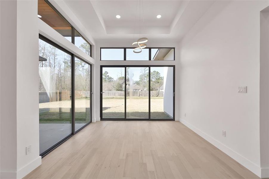 Elegant dining space with expansive windows and serene views.