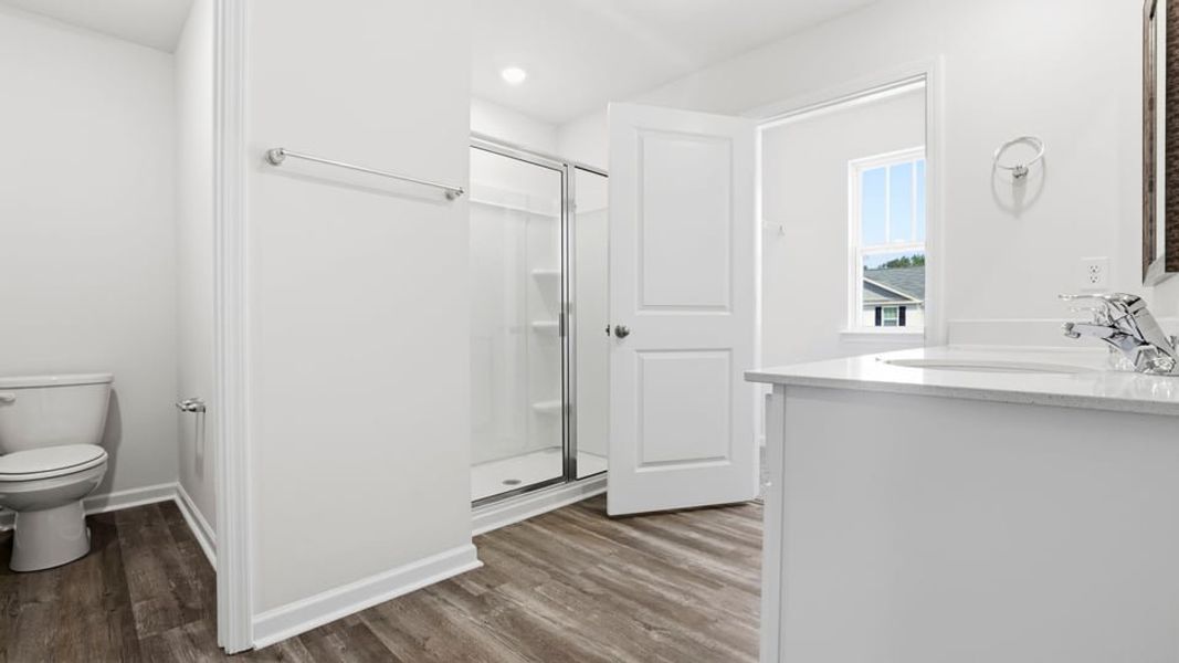 Furnished interior view inside a new home in Bentley Park, Greenwood (Image 9).