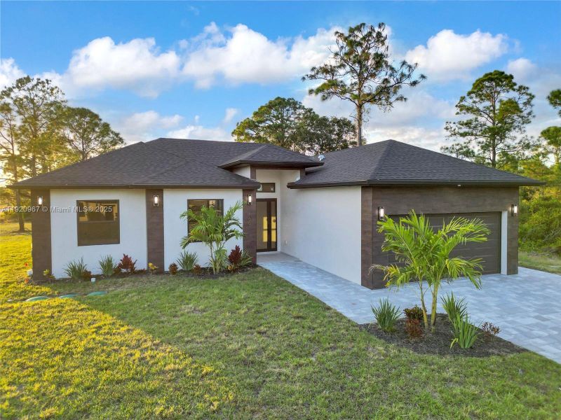 Front exterior of a new home in , Lehigh Acres, FL, highlighting curb appeal (Image 18).