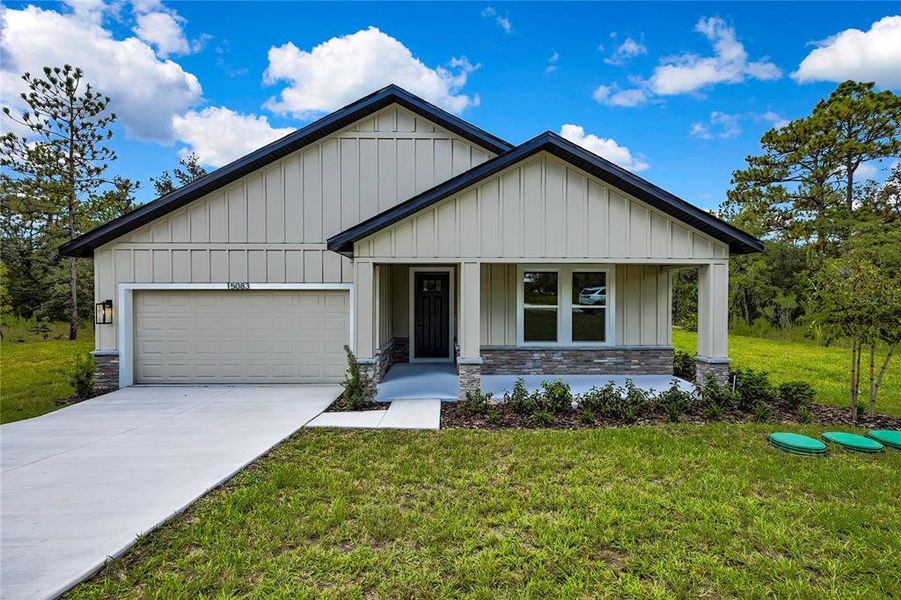 Front exterior of a new home in , Brooksville, FL, highlighting curb appeal (Image 1).