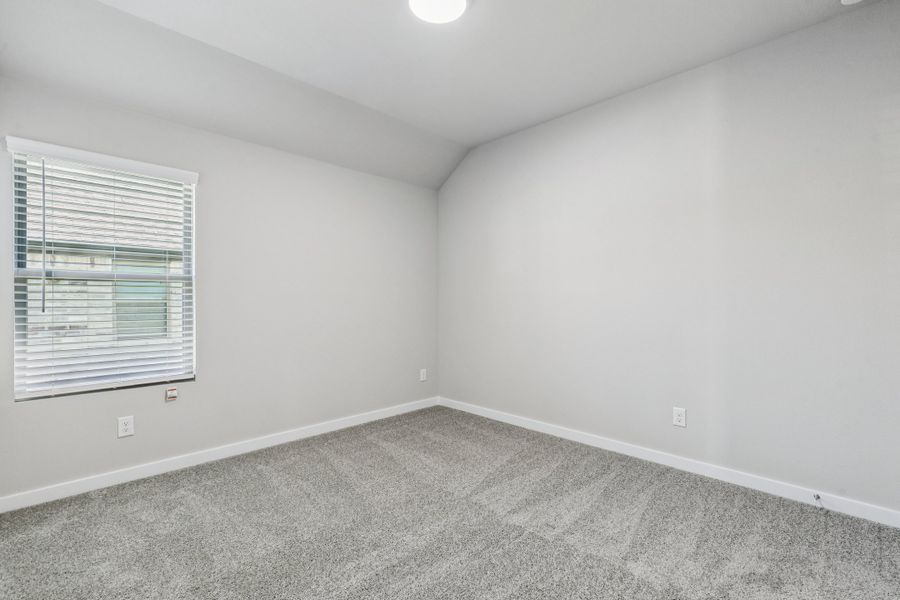 Bedroom in the Heisman home plan by Trophy Signature Homes – REPRESENTATIVE PHOTO Bedroom in the Heisman home plan by Trophy Signature Homes – REPRESENTATIVE PHOTO