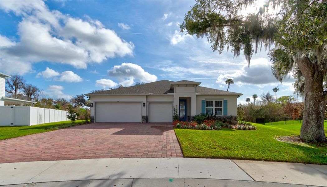 Front exterior of a new home in Copper Creek, New Smyrna Beach, FL, highlighting curb appeal (Image 23). Front exterior of a new home in Copper Creek, New Smyrna Beach, FL, highlighting curb appeal (Image 23).