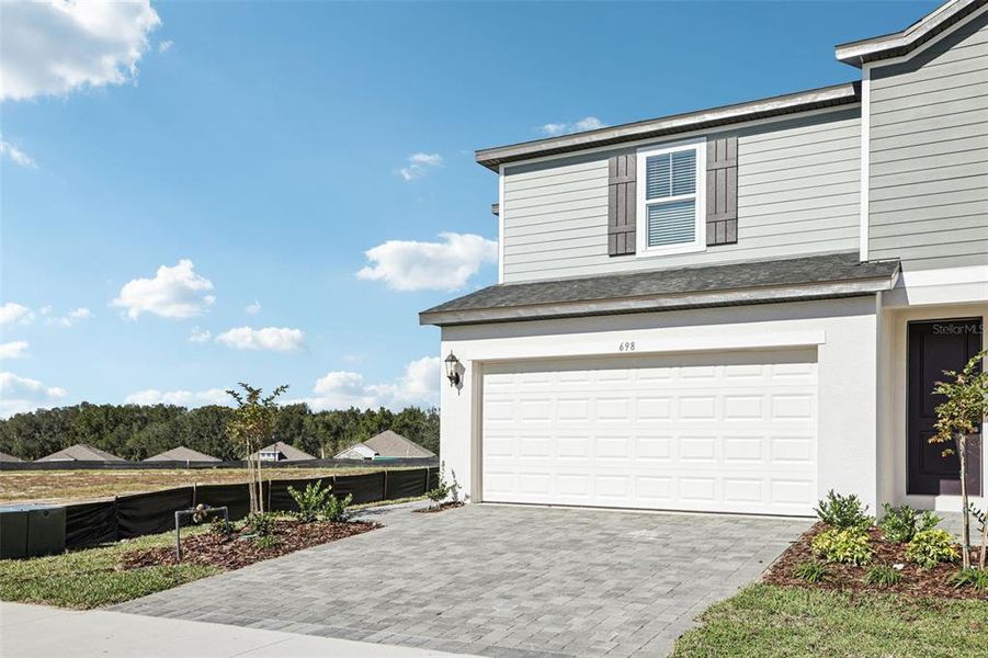 Front exterior of a new home in , Lady Lake, FL, highlighting curb appeal (Image 25).