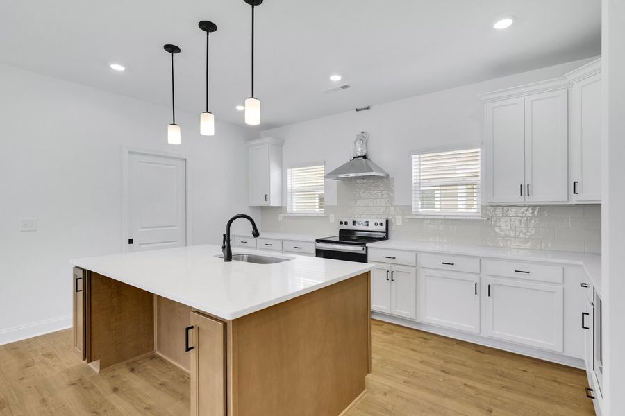 Representative furnished interior of a home built from the Titusville II by Regent Homes in Marlon's Creek, Spring Hill (Image 7).