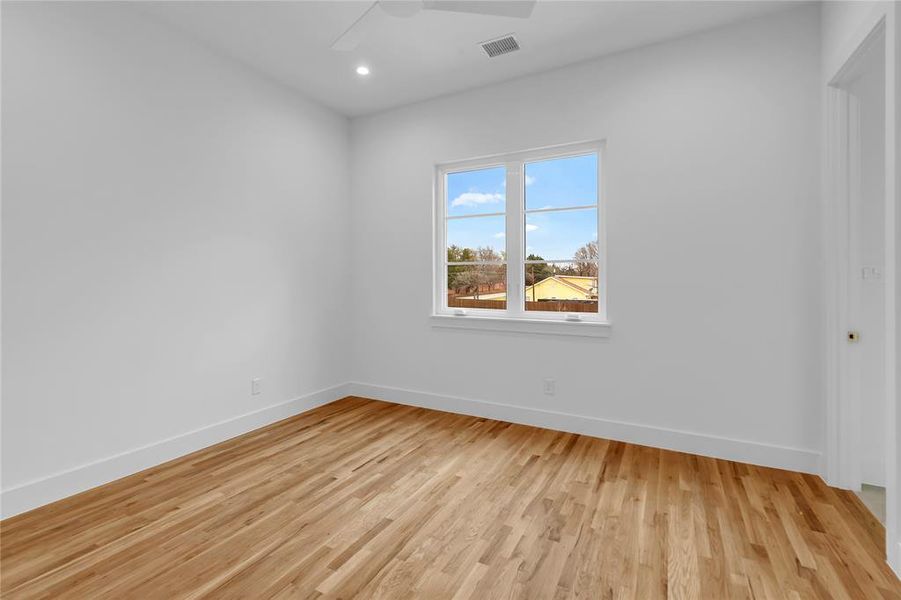 Unfurnished room with light wood finished floors, recessed lighting, and a ceiling fan