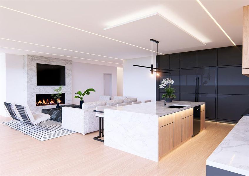 Kitchen featuring a kitchen island with sink, light stone counters, a breakfast bar, and a premium fireplace Kitchen featuring a kitchen island with sink, light stone counters, a breakfast bar, and a premium fireplace