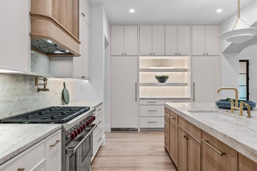 Kitchen with custom exhaust hood- Taj Mahal counters