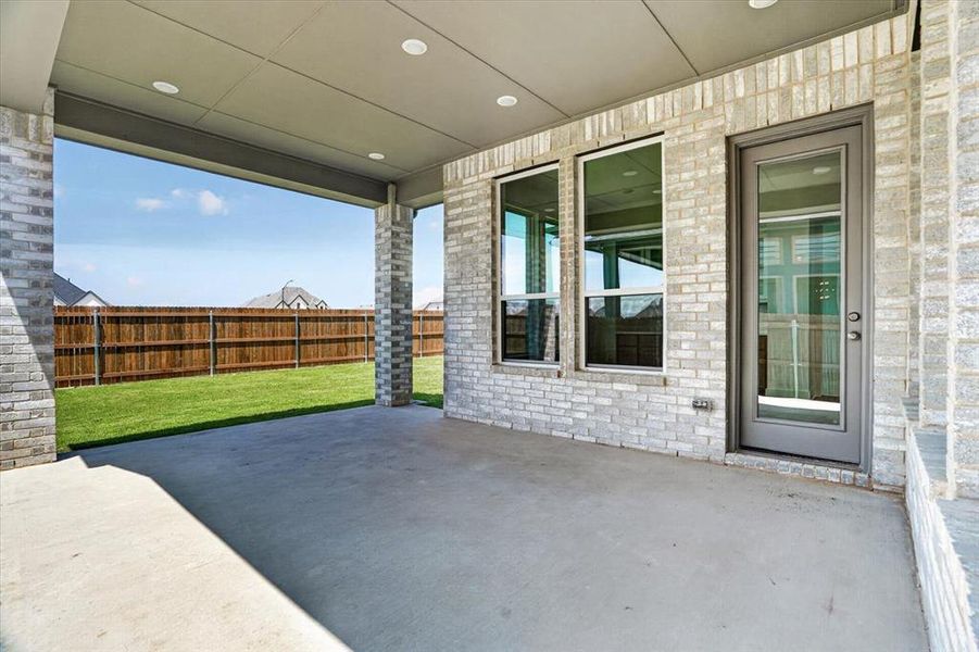 Exterior details and patio area of a home in Tavolo Park, Fort Worth (Image 16).