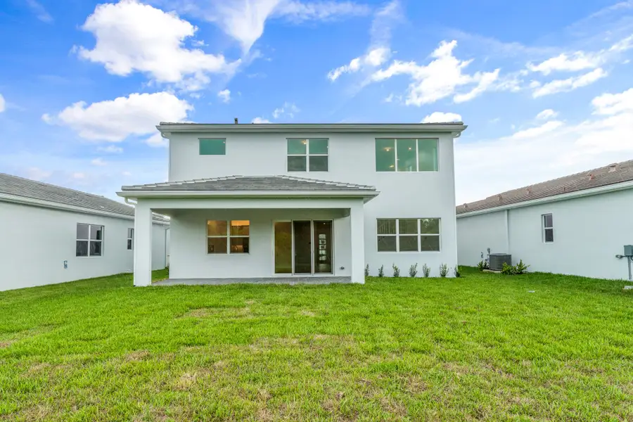 Exterior details and patio area of a home in Tradition, Port St. Lucie (Image 2).