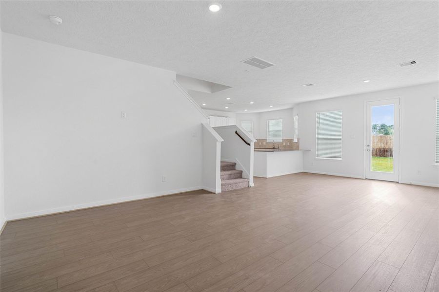 Beautiful open-concept layout effortlessly uniting the living, dining, and kitchen spaces—ideal for everyday comfort and entertaining guests!