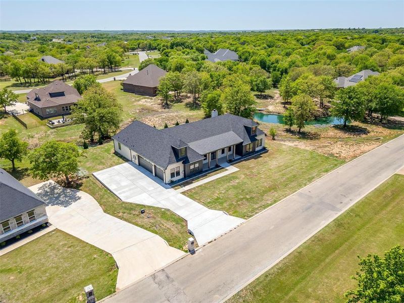 Front exterior of a new home in , Lipan, TX, highlighting curb appeal (Image 25).