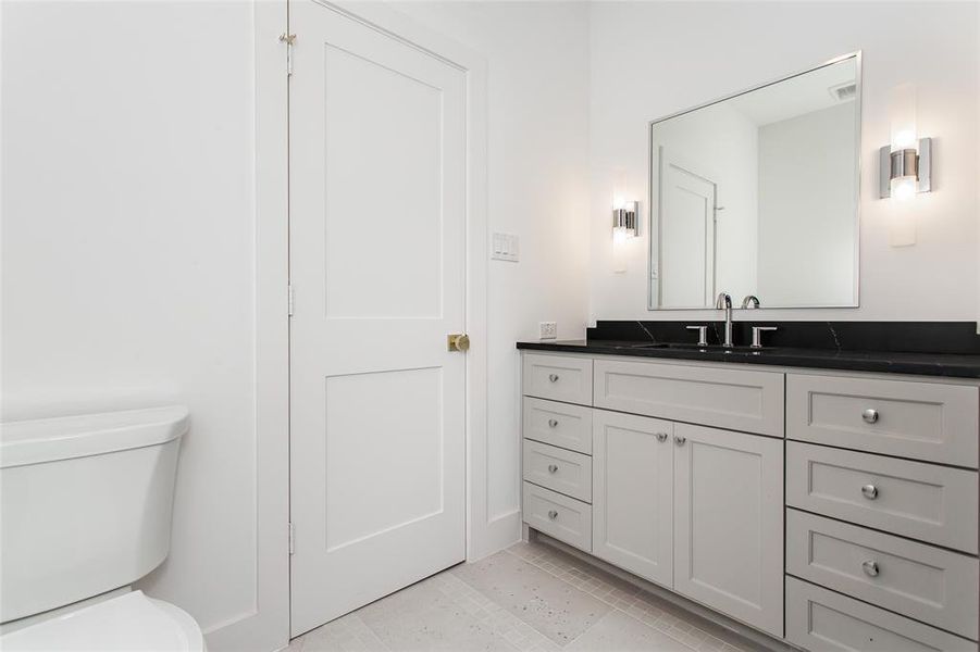 Full bath with access from gamer roo hallway and ensuite for bedroom 4