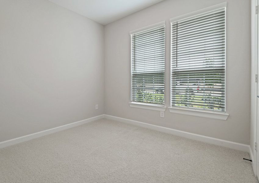 Bedroom with lush carpet flooring