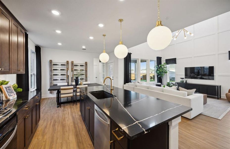 *Model Representation - Large island overlooking gathering room and dining areas