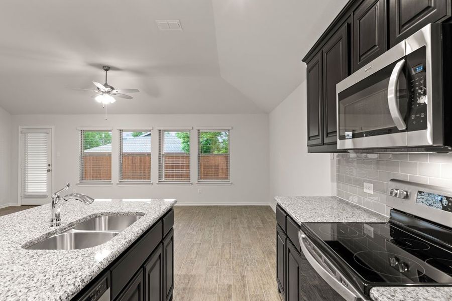 Representative exterior photo of a completed home built from the Austin by Impression Homes in DeBerry Reserve, Royse City, TX (Image 8). Representative exterior photo of a completed home built from the Austin by Impression Homes in DeBerry Reserve, Royse City, TX (Image 8).