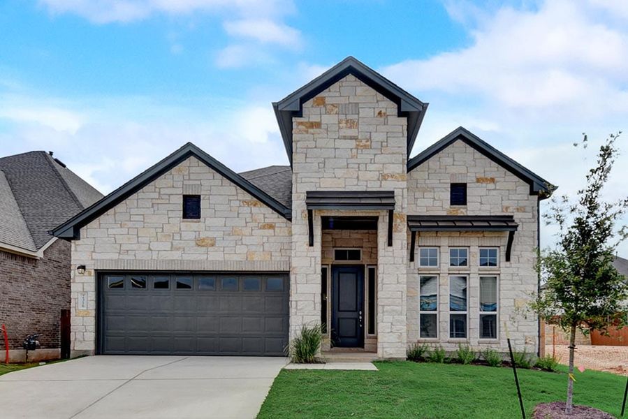 Front exterior of a new home in Sauls Ranch, Round Rock, TX, highlighting curb appeal (Image 3).