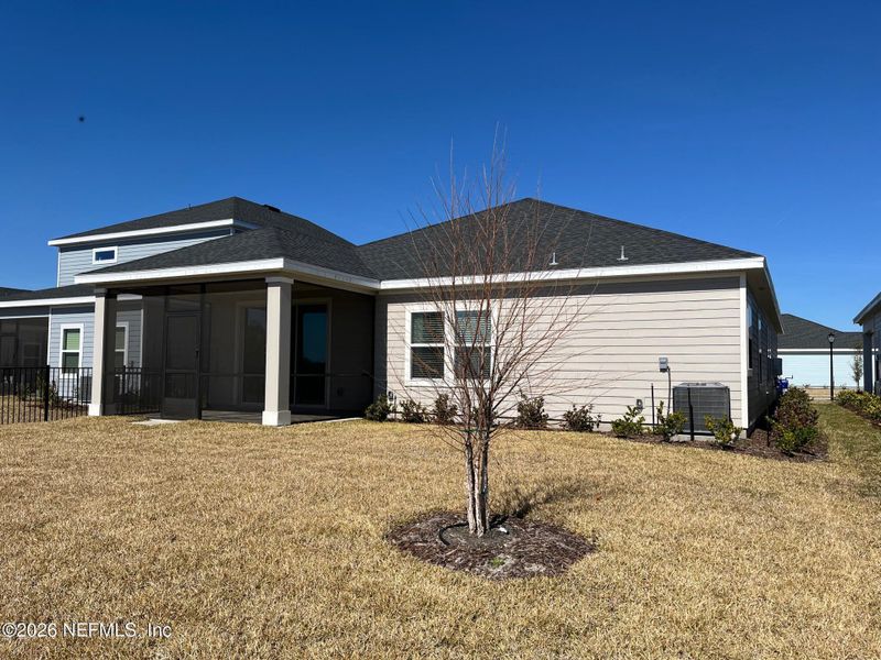Exterior details and patio area of a home in Silver Falls Single Family at SilverLeaf, St. Augustine (Image 20).