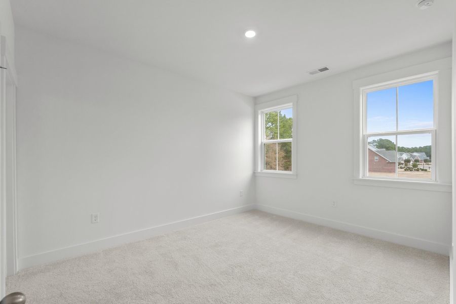 Spacious, unfurnished interior of a new home in Long Bay Golf Club, Longs (Image 35).