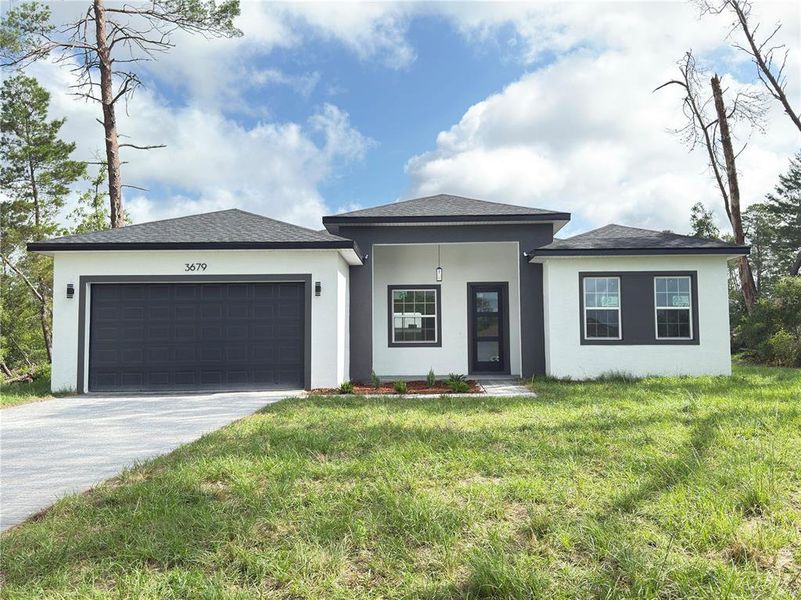 Front exterior of a new home in , Ocala, FL, highlighting curb appeal (Image 27).
