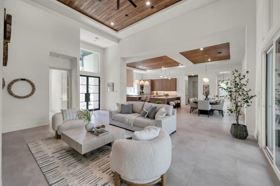 The main living space is anchored by expansive windows and seamless indoor-outdoor flow, offering an open yet intimate setting designed for both everyday living and elevated entertaining.