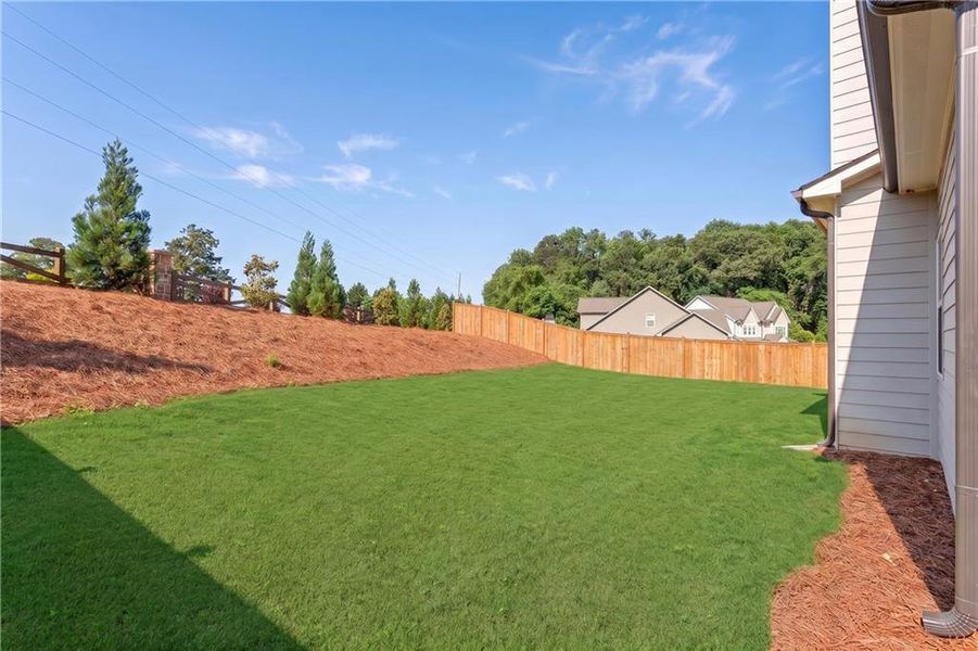 Exterior details and patio area of a home in Hidden Fields, Hoschton (Image 4).