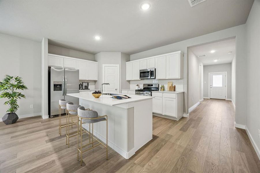 Kitchen in the Holden home plan by Trophy Signature Homes – REPRESENTATIVE PHOTO