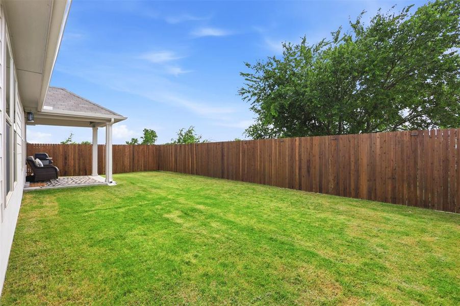 Exterior details and patio area of a home in Tesoro at Chisholm Trail Ranch, Crowley (Image 3).