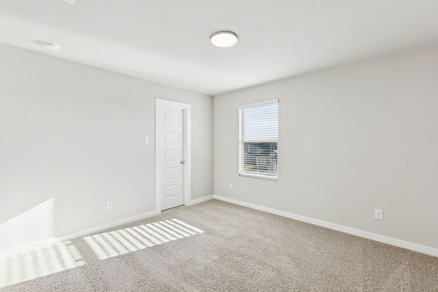 Bedroom in the Haylee home plan by Trophy Signature Homes - REPRESENTATIVE PHOTO