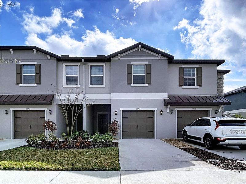 Front exterior of a new home in , Land O' Lakes, FL, highlighting curb appeal (Image 1). Front exterior of a new home in , Land O' Lakes, FL, highlighting curb appeal (Image 1).
