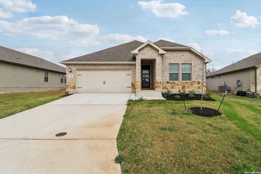 Front exterior of a new home in Legendary Trails - Classic Series, Cibolo, TX, highlighting curb appeal (Image 26).