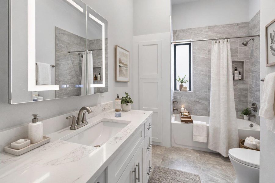 Full bath featuring vanity and shower / bath combo with shower curtain