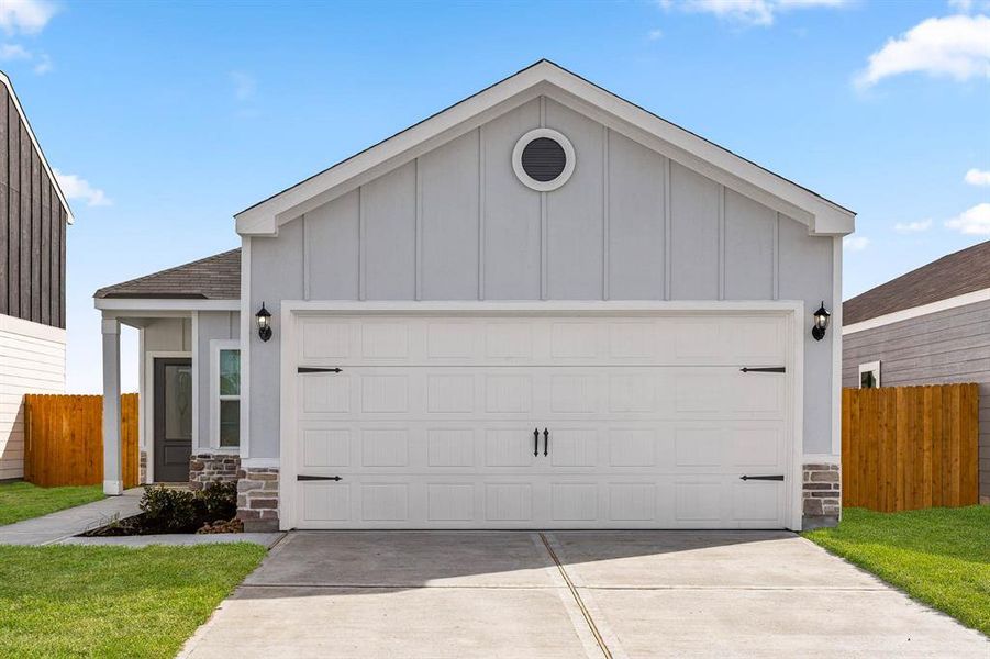 The Pecan floor plan has beautiful stone detailing on the façade of the home.