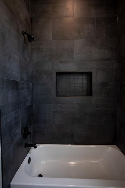 Bathroom featuring shower / washtub combination Bathroom featuring shower / washtub combination