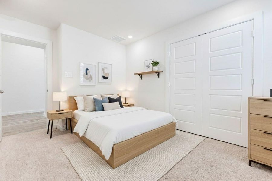 Bright and inviting, this additional bedroom is a perfect fit for family, guests, or your own creative use. Double-door closet space, modern recessed lighting, and soft carpeting provide the ideal mix of practicality and comfort. This photo has been virtually staged for visual reference. Bright and inviting, this additional bedroom is a perfect fit for family, guests, or your own creative use. Double-door closet space, modern recessed lighting, and soft carpeting provide the ideal mix of practicality and comfort. This photo has been virtually staged for visual reference.