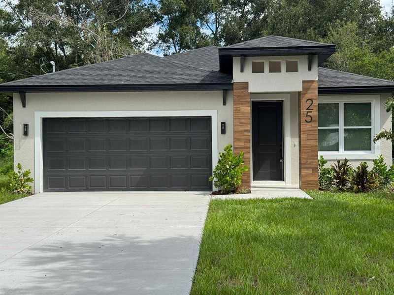 Front exterior of a new home in , Apopka, FL, highlighting curb appeal (Image 1).