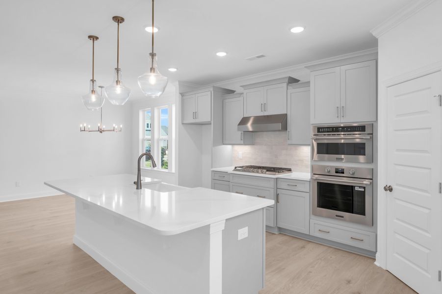 Representative furnished interior of a home built from the The Highland by RobuckHomes in Windwater, Hampstead (Image 20).