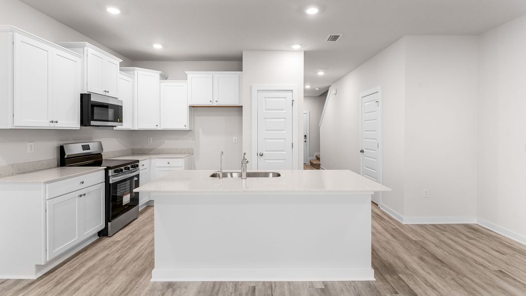 Furnished interior view inside a new home in Genoa Landing Townhomes, Freeport (Image 8).