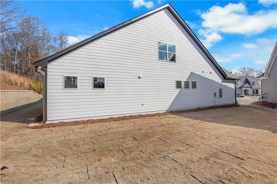 Exterior details and patio area of a home in Marble Tree, Ball Ground (Image 3).