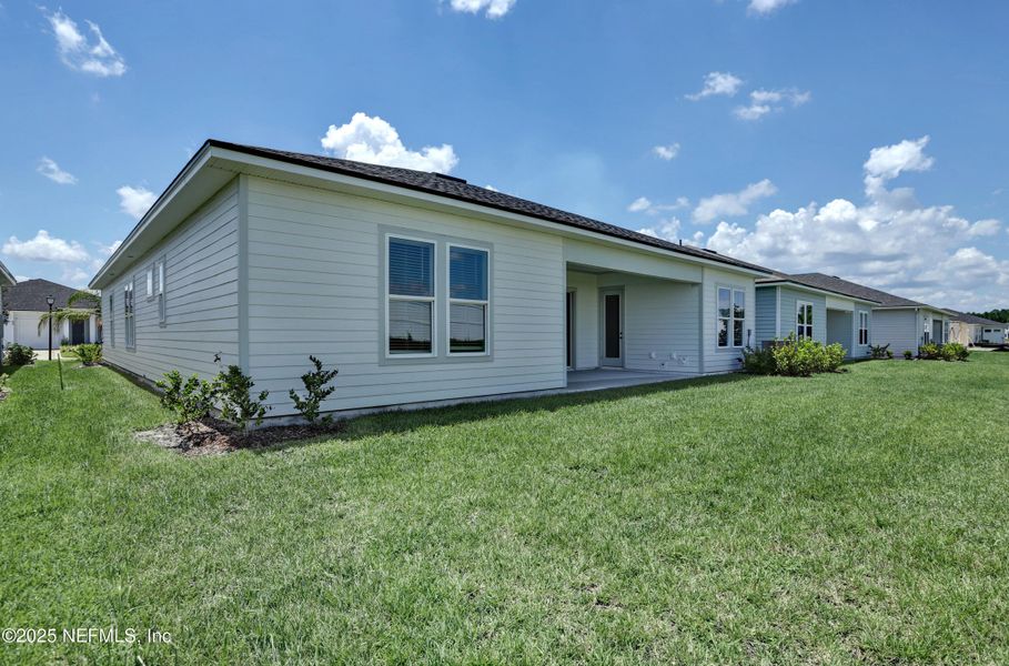 Front exterior of a new home in Reverie at Silverleaf, St. Augustine, FL, highlighting curb appeal (Image 15).