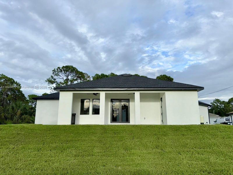 Front exterior of a new home in , Lehigh Acres, FL, highlighting curb appeal (Image 21).