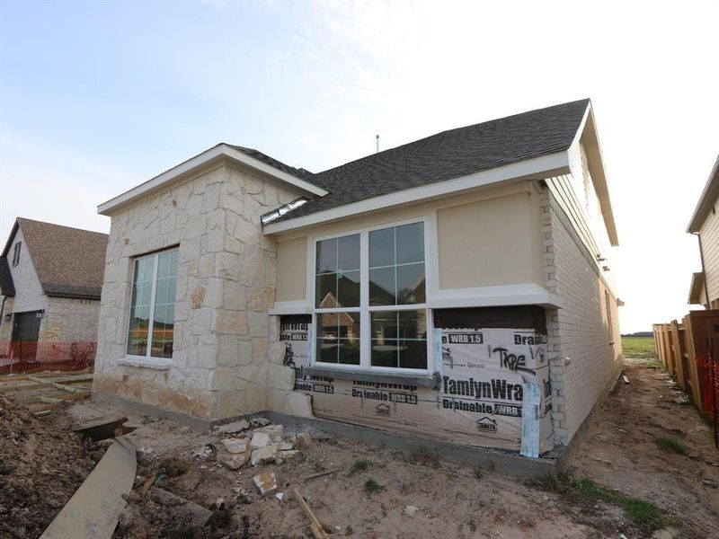 Front exterior of a new home in Marvida, Cypress, TX, highlighting curb appeal (Image 16).