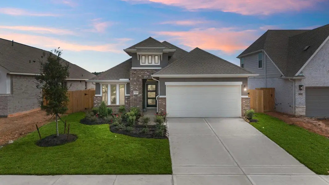 Front exterior of a new home in Escondido, Magnolia, TX, highlighting curb appeal (Image 1).