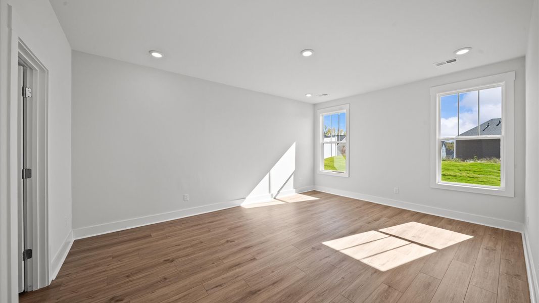 First-rate hardwood flooring and thoughtful upgrades in this select home by DRB Homes