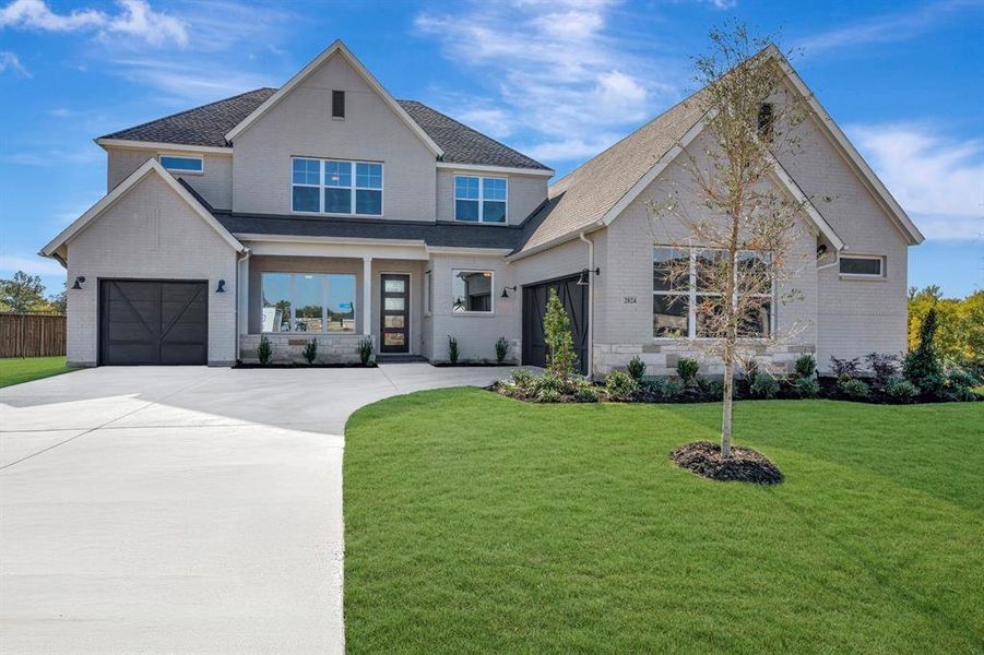 Front exterior of a new home in Northshore at Lakewood Village - Classic Series, Lakewood Village, TX, highlighting curb appeal (Image 1). Front exterior of a new home in Northshore at Lakewood Village - Classic Series, Lakewood Village, TX, highlighting curb appeal (Image 1).