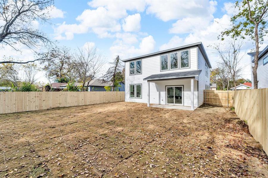 Back of house with a patio area