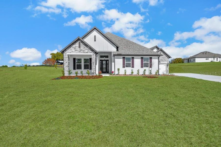 Front exterior of a new home in , Fruitland Park, FL, highlighting curb appeal (Image 1). Front exterior of a new home in , Fruitland Park, FL, highlighting curb appeal (Image 1).