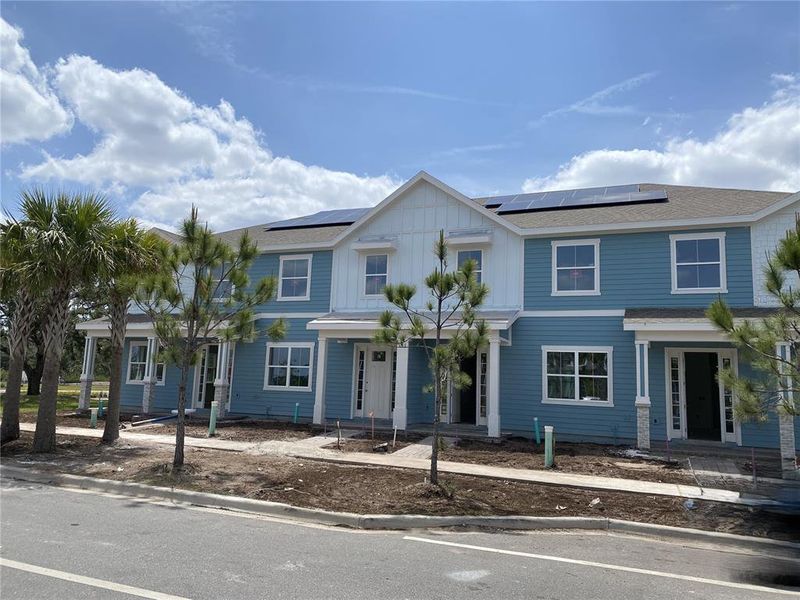 Front exterior of a new home in Weslyn Park at Sunbridge (Craft Homes), St. Cloud, FL, highlighting curb appeal (Image 1).