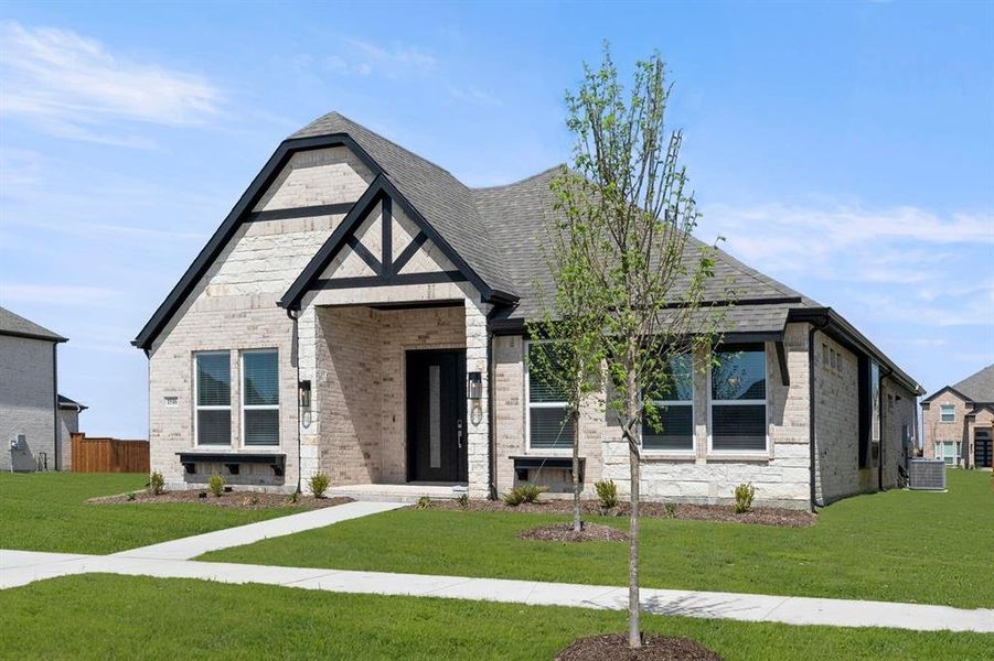 Front exterior of a new home in Villages of Creekwood, Frisco, TX, highlighting curb appeal (Image 20).