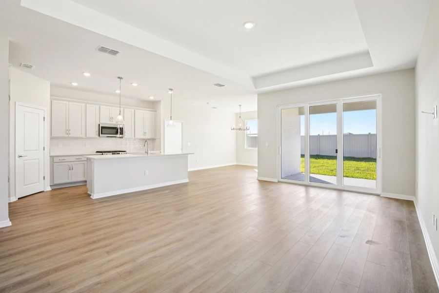 Open concept family, dining and kitchen spaces