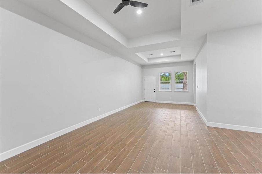 Alternate living area view w/ durable wood-style flooring Alternate living area view w/ durable wood-style flooring